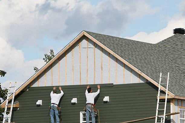 Professional Storm Damage Siding Repair technician working in Bayville, NY